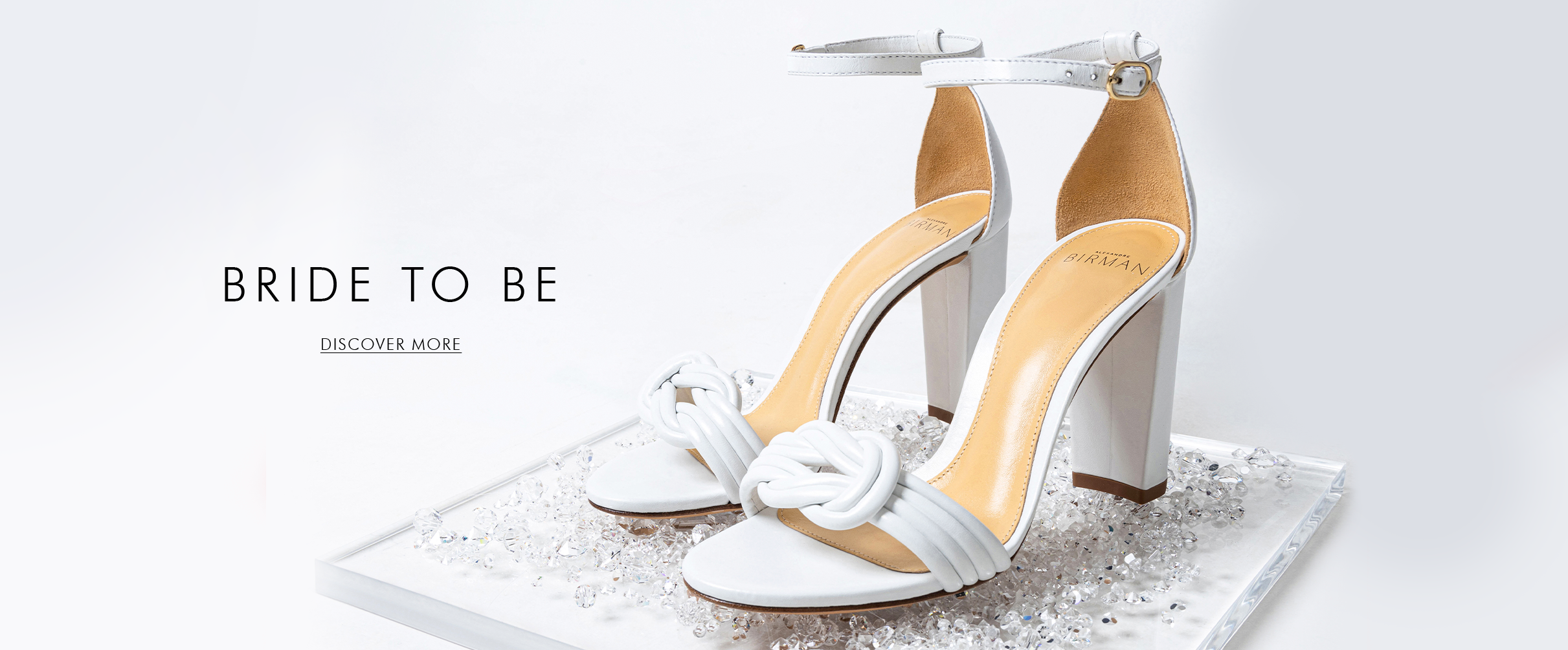 Complete your bridal ensemble with the exquisite Vicky Block 100 Sandal in White. Elevate your wedding look with the bridal collection.