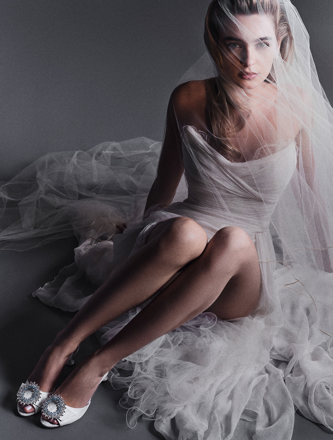 Model wearing bridal gown showcases the Easy Madelina 85 Sandal in Ivory. Click to shop.