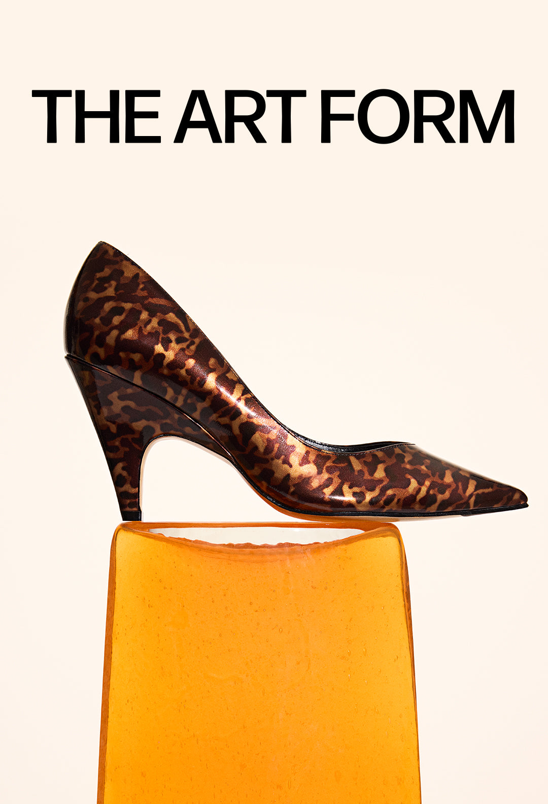  A widescreen image of a leopard-print pump with a uniquely sculpted heel, standing on an orange block. The text "THE ART FORM" is on the right.